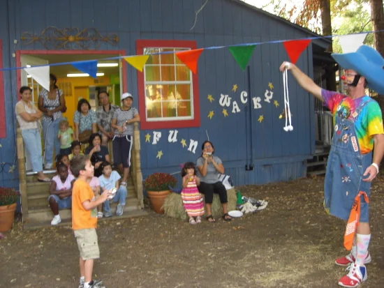 Cowboy Mike entertaining children with his colorful magic show